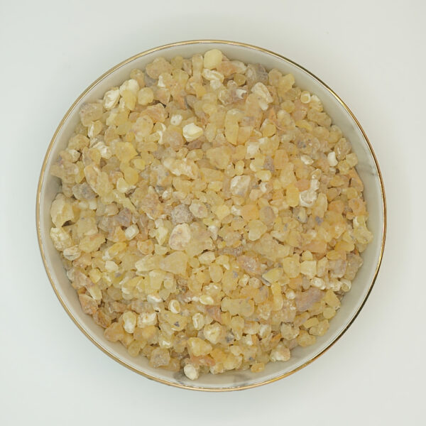 Top view of Maydi Fas Kabir frankincense (Boswellia frereana) in a bowl. The resin pieces are small, yellowish to beige and evenly distributed.